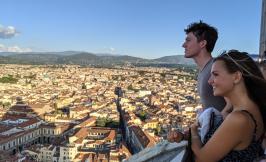 a man and a woman looking out over Florence