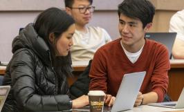 students working together on a computer