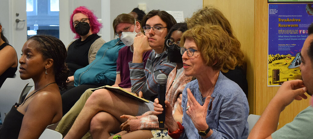 People seated and speaking.
